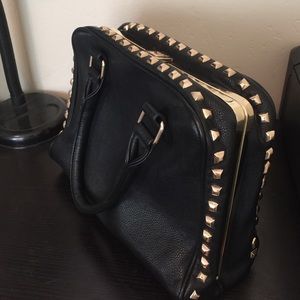Black studded hand bag
